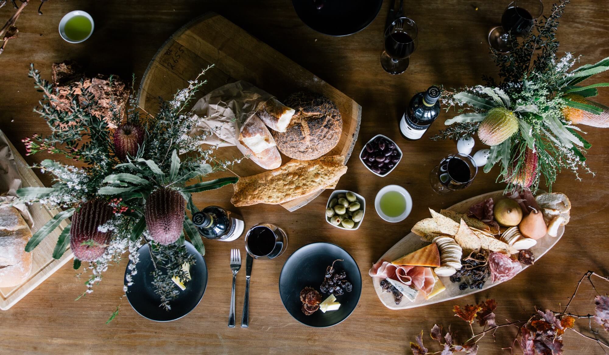 Food and wine on a table at Zema Estate
