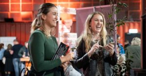 two young girls laugh as they enjoy red wine at the coonawarra roadshow