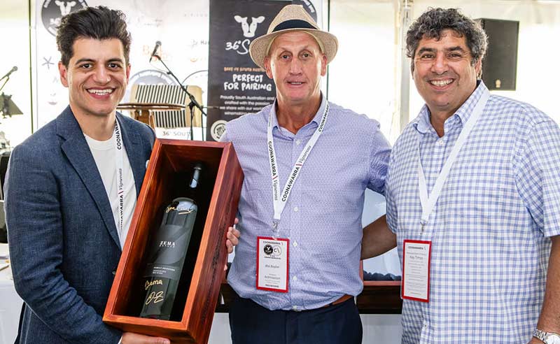 demet and Nick hand imperial wine to auction winner at Coonawarra Cup