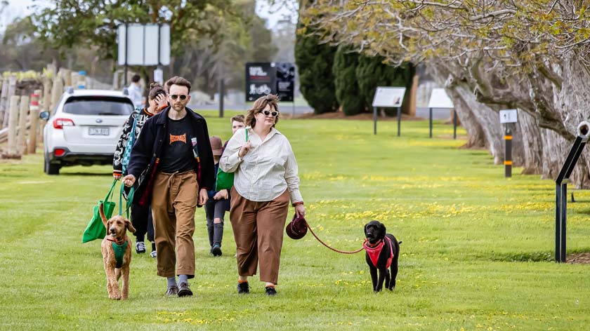 couple with dogs walk along the Coonawarra Walking Trail