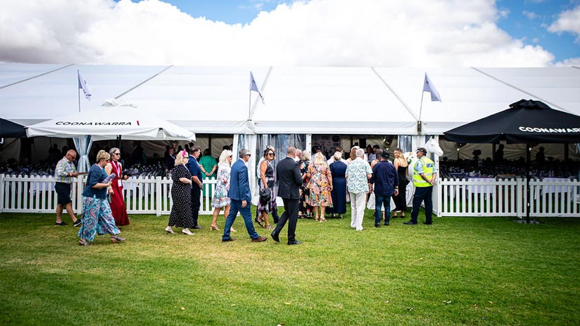 People dressed in racing wear enter the coonawarra vignerons cup