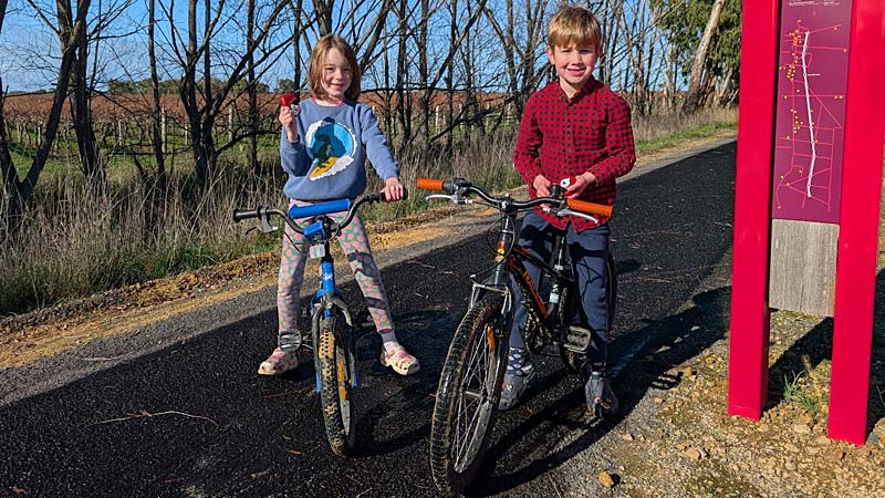 Kids ride bike on Coonawarra winter walk