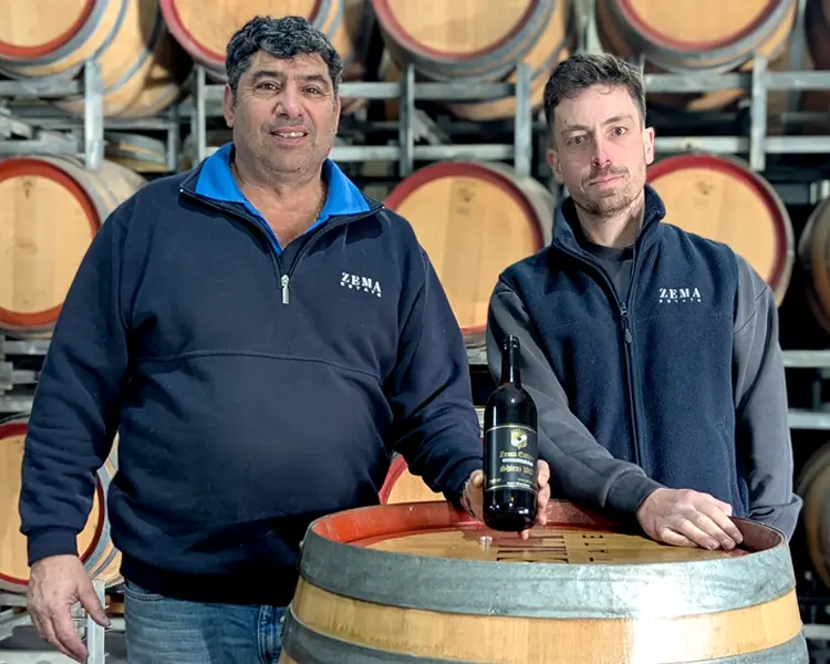 nick zema and lewis white from zema estate with a bottle of 1982 shiraz